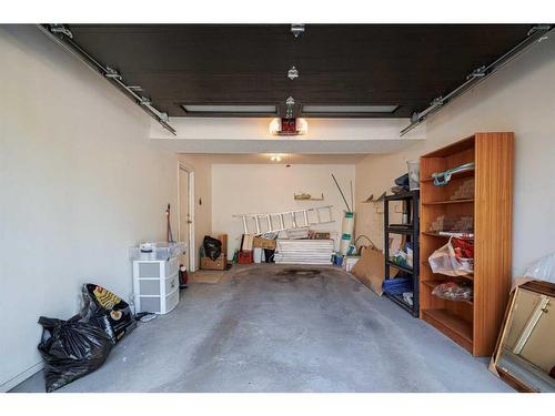 4-10457 19 Street Sw, Calgary, AB - Indoor Photo Showing Garage