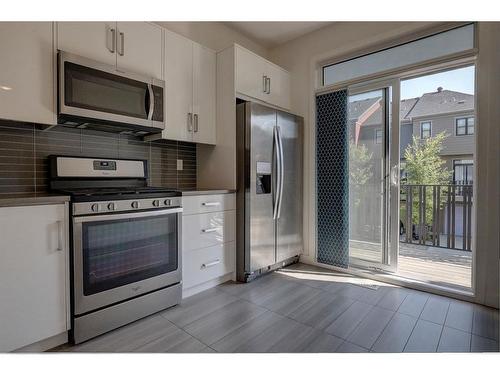 128 Walden Path Se, Calgary, AB - Indoor Photo Showing Kitchen With Stainless Steel Kitchen