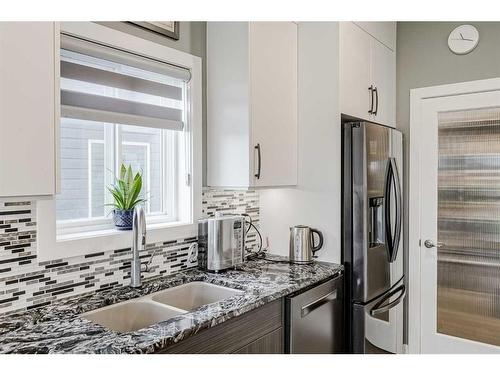 32 Legacy Cove Se, Calgary, AB - Indoor Photo Showing Kitchen With Double Sink With Upgraded Kitchen