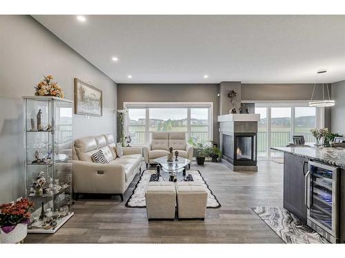 32 Legacy Cove Se, Calgary, AB - Indoor Photo Showing Living Room With Fireplace