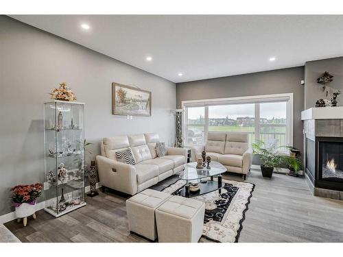 32 Legacy Cove Se, Calgary, AB - Indoor Photo Showing Living Room With Fireplace