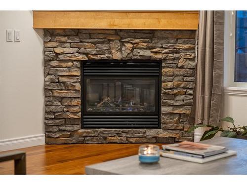 202-1920 26 Street Sw, Calgary, AB - Indoor Photo Showing Living Room With Fireplace