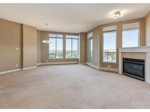 604-1726 14 Avenue Nw, Calgary, AB - Indoor Photo Showing Other Room With Fireplace