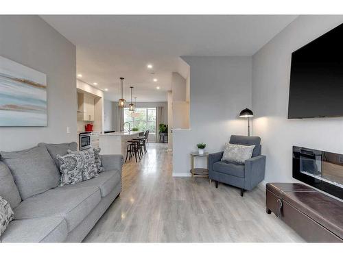 51 Masters Square Se, Calgary, AB - Indoor Photo Showing Living Room With Fireplace