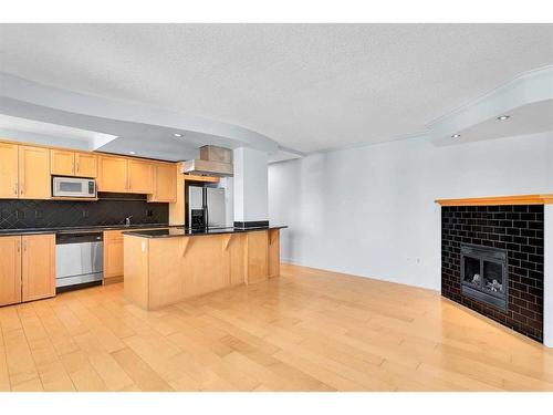 803-1225 15 Avenue Sw, Calgary, AB - Indoor Photo Showing Kitchen With Fireplace