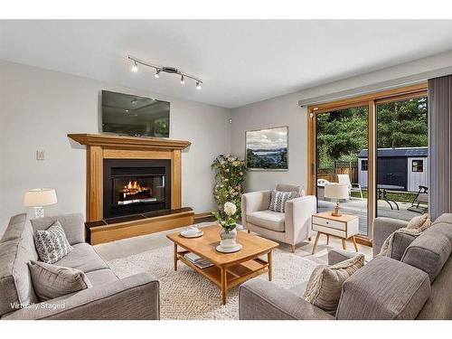 204 Cougar Point Road, Canmore, AB - Indoor Photo Showing Living Room With Fireplace