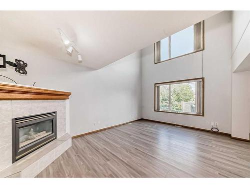 172 Panorama Hills Place Nw, Calgary, AB - Indoor Photo Showing Living Room With Fireplace