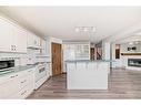 172 Panorama Hills Place Nw, Calgary, AB  - Indoor Photo Showing Kitchen With Fireplace 