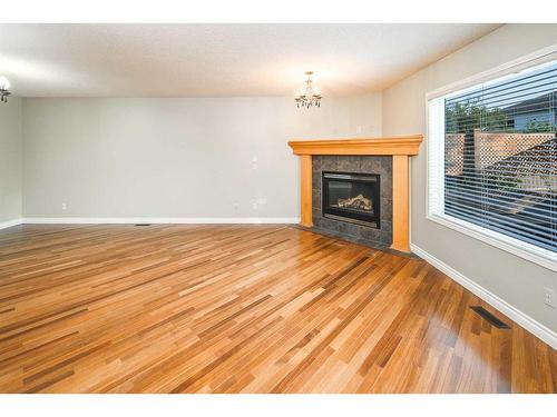 59 Somerset Manor Sw, Calgary, AB - Indoor Photo Showing Living Room With Fireplace