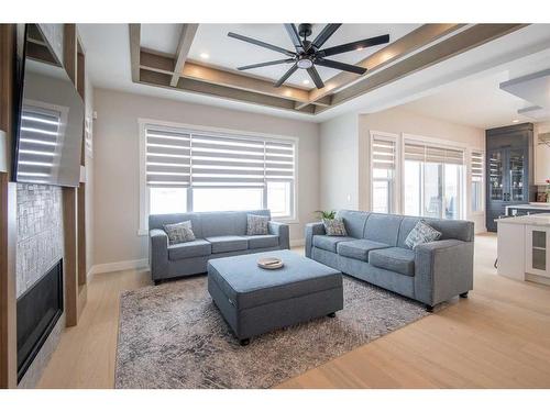 62 Waterford Road, Chestermere, AB - Indoor Photo Showing Living Room With Fireplace