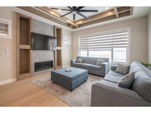 62 Waterford Road, Chestermere, AB - Indoor Photo Showing Living Room With Fireplace