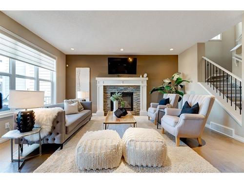 80 Riviera Crescent, Cochrane, AB - Indoor Photo Showing Living Room With Fireplace