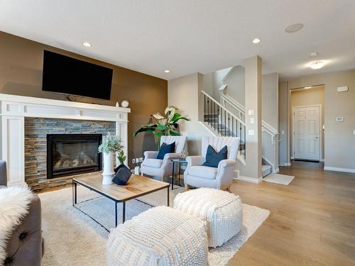 80 Riviera Crescent, Cochrane, AB - Indoor Photo Showing Living Room With Fireplace