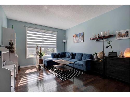 404-10 Auburn Bay Avenue Se, Calgary, AB - Indoor Photo Showing Living Room