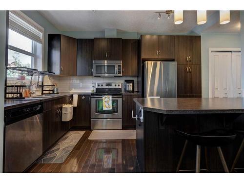 404-10 Auburn Bay Avenue Se, Calgary, AB - Indoor Photo Showing Kitchen With Double Sink