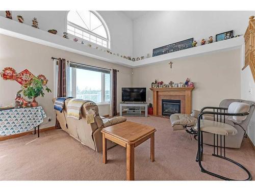 9 Panorama Hills Manor Nw, Calgary, AB - Indoor Photo Showing Living Room With Fireplace