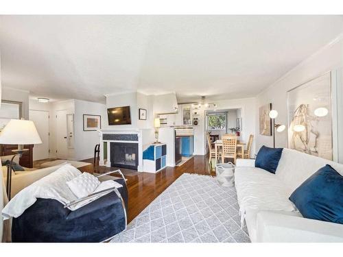 101-516 Cedar Crescent Sw, Calgary, AB - Indoor Photo Showing Living Room With Fireplace