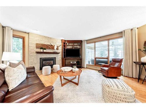 123 Woodhaven Bay Sw, Calgary, AB - Indoor Photo Showing Living Room With Fireplace