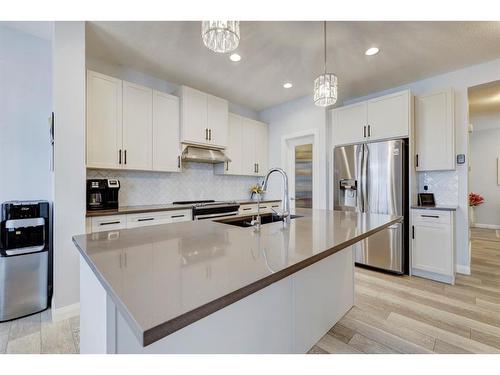 427 Rivercrest Boulevard, Cochrane, AB - Indoor Photo Showing Kitchen With Upgraded Kitchen