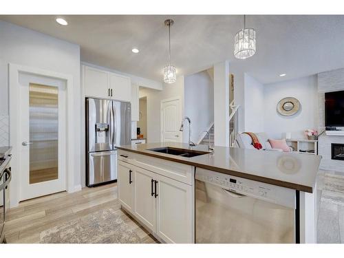 427 Rivercrest Boulevard, Cochrane, AB - Indoor Photo Showing Kitchen With Double Sink With Upgraded Kitchen