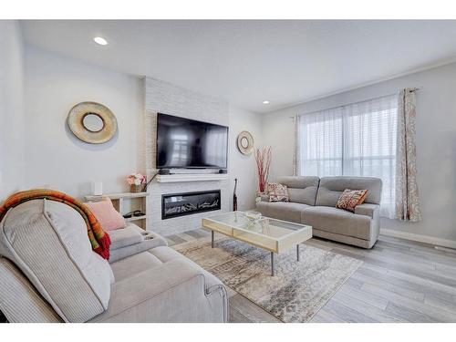 427 Rivercrest Boulevard, Cochrane, AB - Indoor Photo Showing Living Room With Fireplace