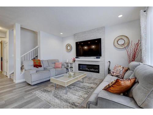 427 Rivercrest Boulevard, Cochrane, AB - Indoor Photo Showing Living Room With Fireplace