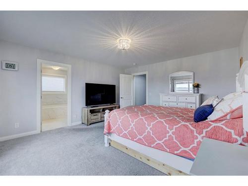 427 Rivercrest Boulevard, Cochrane, AB - Indoor Photo Showing Bedroom