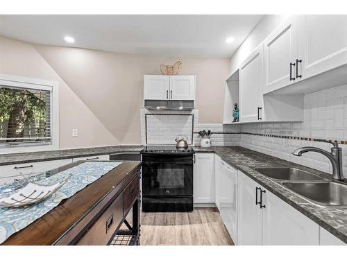 929 17Th Street, Canmore, AB - Indoor Photo Showing Kitchen With Double Sink