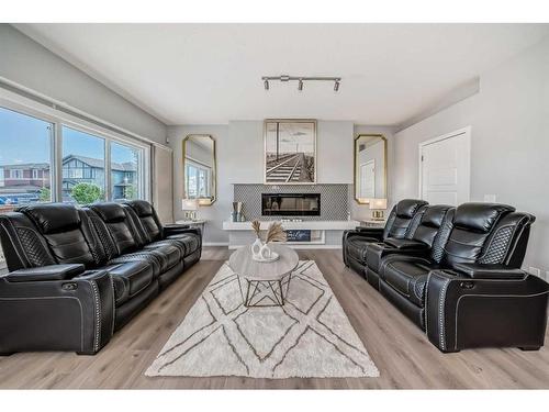 300 Walgrove Boulevard Se, Calgary, AB - Indoor Photo Showing Living Room With Fireplace