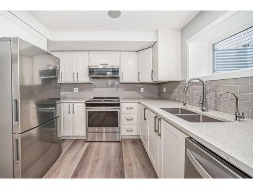 300 Walgrove Boulevard Se, Calgary, AB - Indoor Photo Showing Kitchen With Double Sink