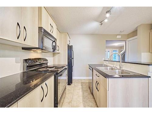 123 Panora Square Nw, Calgary, AB - Indoor Photo Showing Kitchen With Double Sink