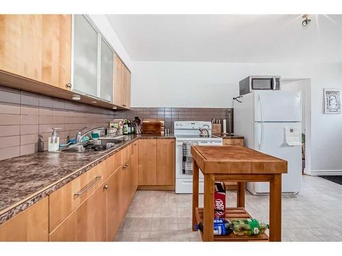 1716 29 Avenue Sw, Calgary, AB - Indoor Photo Showing Kitchen With Double Sink