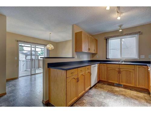 1342 Somerside Drive Sw, Calgary, AB - Indoor Photo Showing Kitchen With Double Sink