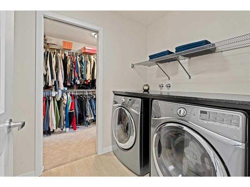 11 Storm Mountain Place, Okotoks, AB - Indoor Photo Showing Laundry Room