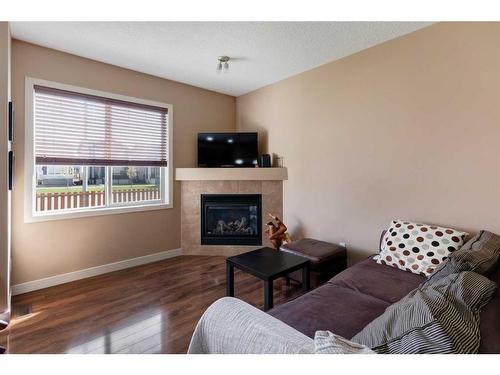 120-413 River Avenue, Cochrane, AB - Indoor Photo Showing Living Room With Fireplace