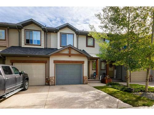 120-413 River Avenue, Cochrane, AB - Outdoor With Facade