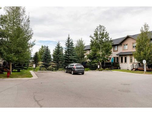 120-413 River Avenue, Cochrane, AB - Outdoor With Facade