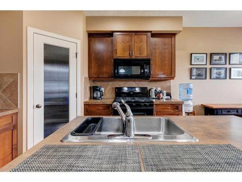 120-413 River Avenue, Cochrane, AB - Indoor Photo Showing Kitchen With Double Sink