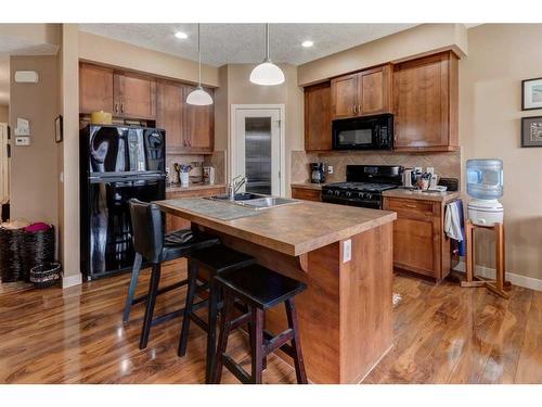 120-413 River Avenue, Cochrane, AB - Indoor Photo Showing Kitchen With Double Sink