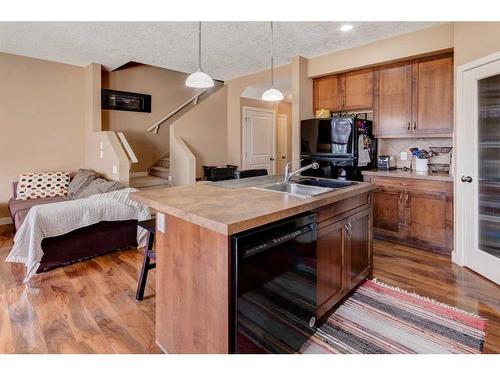 120-413 River Avenue, Cochrane, AB - Indoor Photo Showing Kitchen With Double Sink