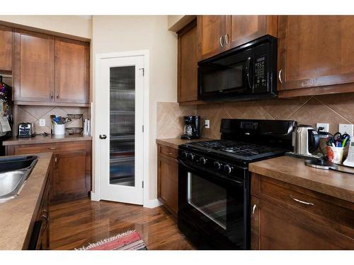 120-413 River Avenue, Cochrane, AB - Indoor Photo Showing Kitchen