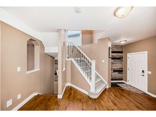 63 Chapalina Crescent Se, Calgary, AB - Indoor Photo Showing Living Room With Fireplace