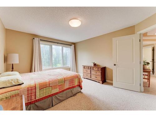 76 Coulee View Sw, Calgary, AB - Indoor Photo Showing Bedroom