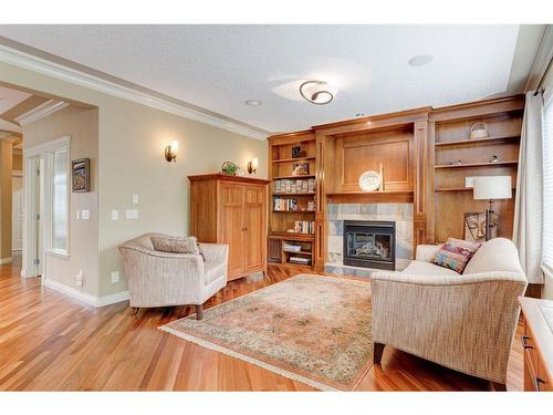 76 Coulee View Sw, Calgary, AB - Indoor Photo Showing Living Room With Fireplace