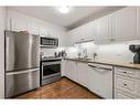 111-550 Prominence Rise Sw, Calgary, AB  - Indoor Photo Showing Kitchen With Double Sink 