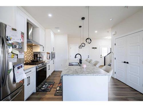 68 Midtown Close Sw, Airdrie, AB - Indoor Photo Showing Kitchen With Upgraded Kitchen