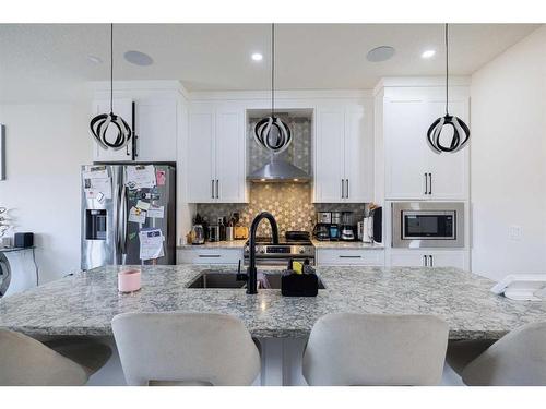 68 Midtown Close Sw, Airdrie, AB - Indoor Photo Showing Kitchen With Upgraded Kitchen