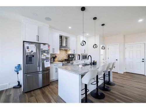 68 Midtown Close Sw, Airdrie, AB - Indoor Photo Showing Kitchen With Upgraded Kitchen