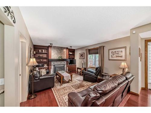 3 Sandringham Way Nw, Calgary, AB - Indoor Photo Showing Living Room With Fireplace