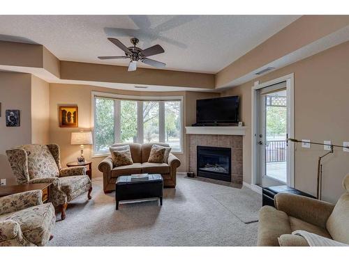 1117-48 Inverness Gate Se, Calgary, AB - Indoor Photo Showing Living Room With Fireplace